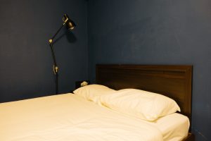 A comfortable PG accommodation concept in Karnal for factory workers, highlighting furnished rooms, security, parking, Wi-Fi, and convenient access to industrial workplaces.
